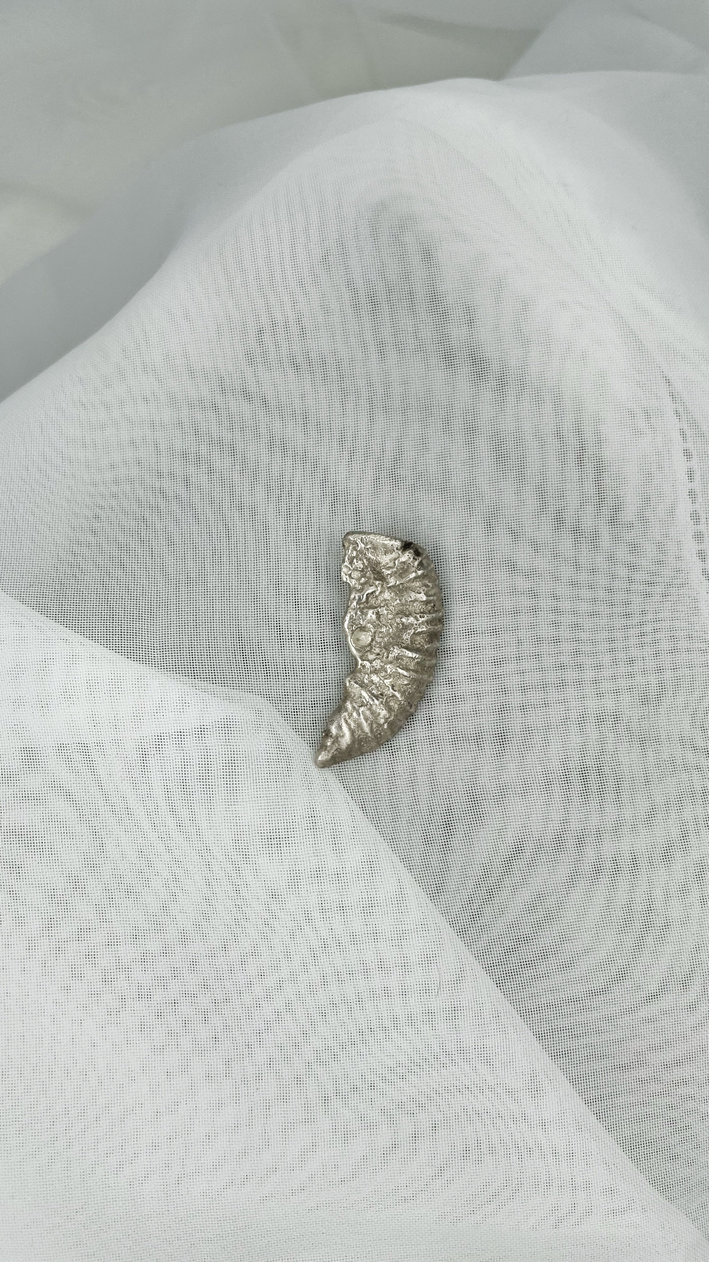 Hanger gegoten fossiel